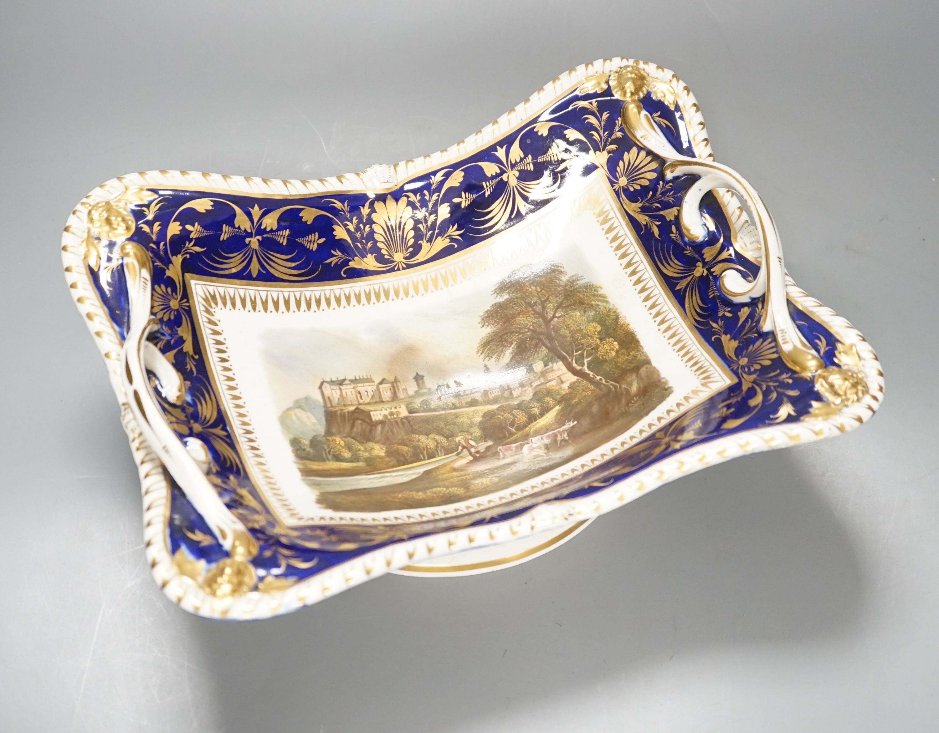 A Derby two handled pedestal dish with a named view of Sterling Castle, under a blue and gilt border probably by Daniel Lucas, c.1815, width 29cm